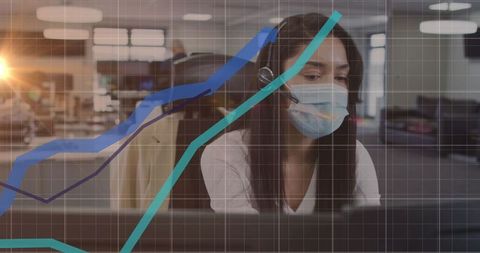 Businesswoman analyzing data amidst pandemic in modern office