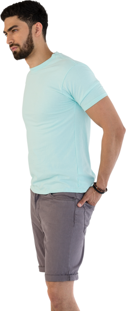 Fashionable man standing with hands in pockets wearing turquoise shirt, grey shorts - Download Free Stock Videos Pikwizard.com