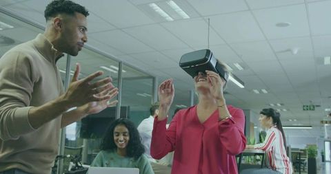 Team Discussing Virtual Reality Innovation in Modern Office