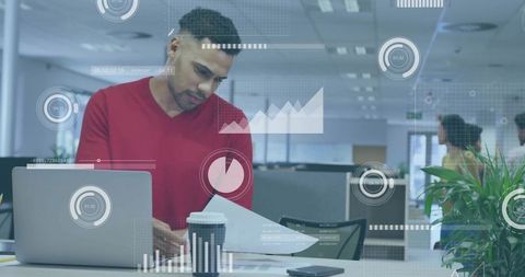 Businessman Analyzing Data in Modern Office with Augmented Analytics Overlay