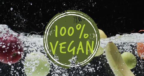 100 percent vegan concept with fresh fruits in water splash