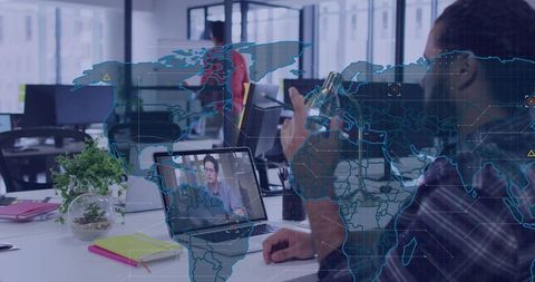 Remote collaboration drinking from bottle during virtual meeting with global map overlay