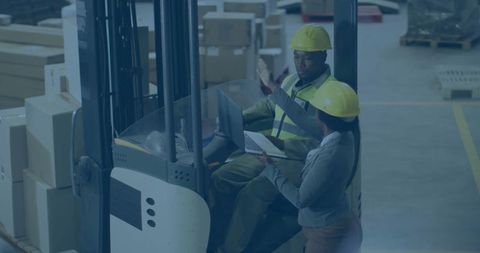 Industrial Warehouse Team Operating Forklift with Efficiency