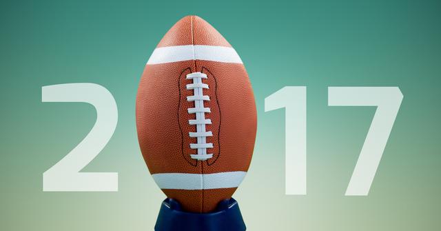 Digital composite image of rugby ball forming 2017 against blue background