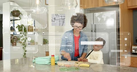 Parent and child preparing school lunch with augmented reality hud in modern kitchen