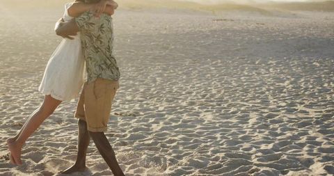 Romantic Beach Embrace at Sunset in Casual Attire