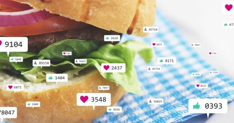 Juicy burger close-up with floating social media likes and heart badges for food marketing