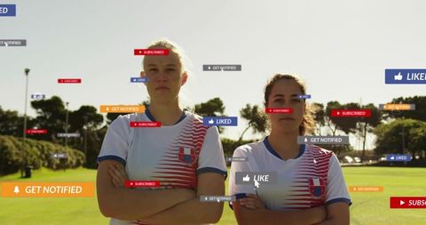 Female soccer duo on sunlit field with social media like subscribe notification badges
