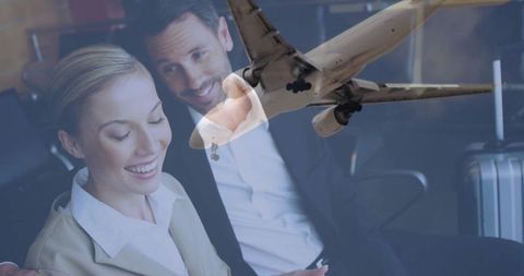 Business Executives Collaborating on Tablet with Airplane Overlay