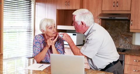 Senior Couple Arguing in Modern Kitchen Interior