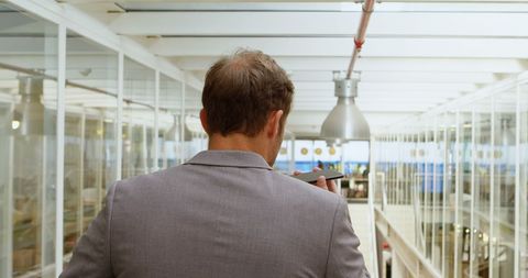 Businessman Walking in Modern Office Building