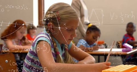 Focused schoolgirl solving math problems with formulas overlay
