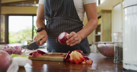 Pregnant Woman Preparing Meal in Cozy Kitchen