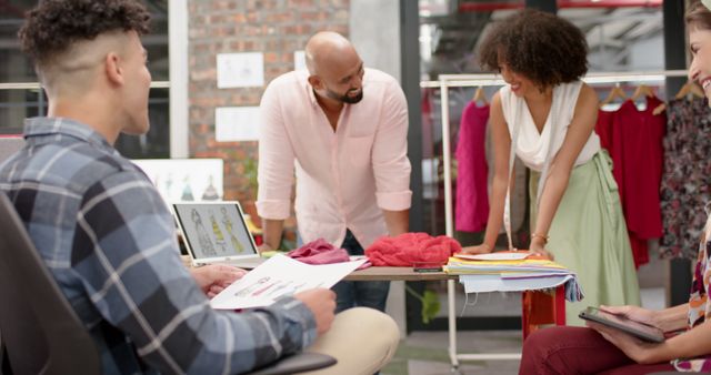 Creative Team Discussing Fashion Designs in Modern Studio - Download Free Stock Images Pikwizard.com