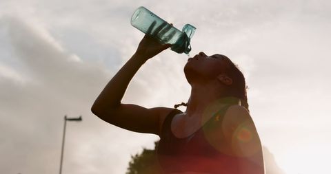 Exhausted Woman Hydrating After Exhaustive Workout - Download Free Stock Images Pikwizard.com