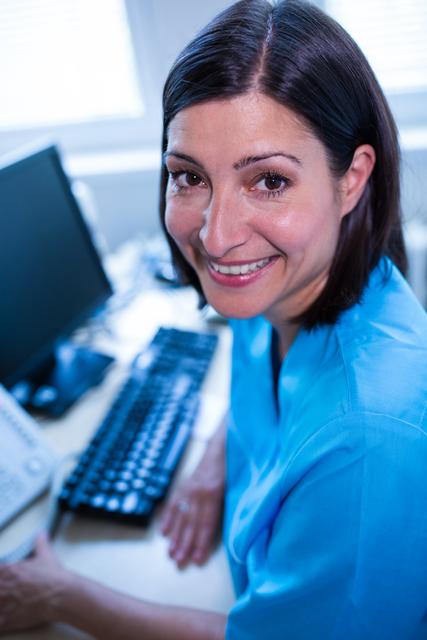 Smiling Female Doctor in Medical Office - Download Free Stock Photos Pikwizard.com