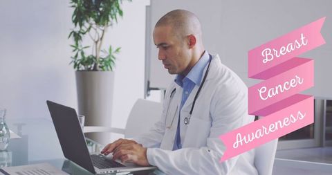 Breast Cancer Awareness: Doctor Using Laptop in Modern Office