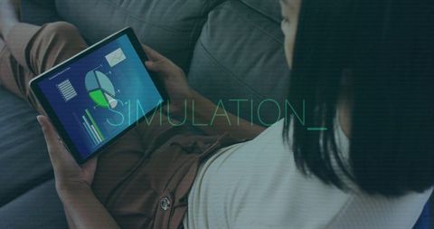 Reclining woman viewing interactive data dashboard on tablet with simulation overlay