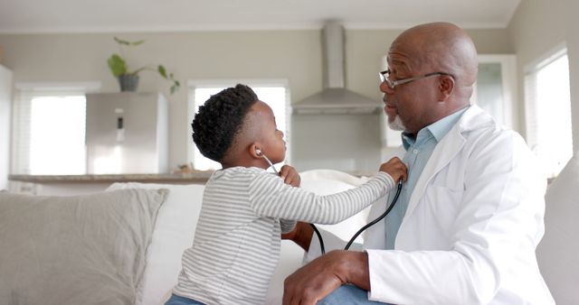 Child Playing Doctor with Grandfather at Home - Download Free Stock Images Pikwizard.com