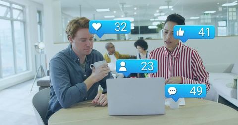 Colleagues Collaborating in Lounge with Social Media Overlay