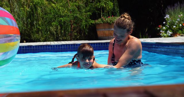 Mother Teaching Son to Swim in Outdoor Pool - Download Free Stock Images Pikwizard.com