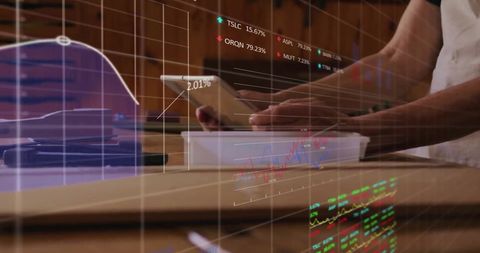 Businessman Analyzing Financial Data with Tablet in Office