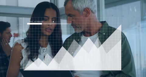 Diverse Colleagues Analyzing Financial Growth Chart in Modern Office