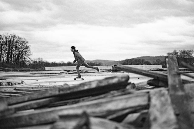 Young Man Skateboarding in Rustic Outdoor Setting - Download Free Stock Photos Pikwizard.com