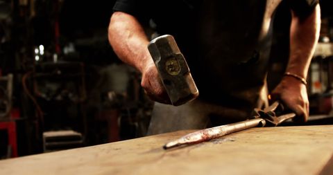 Skilled Blacksmith Forging Metal in Industrial Workshop - Download Free Stock Images Pikwizard.com