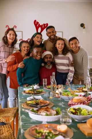 Joyful Family Celebrating Holiday with Festive Feast and Decorations