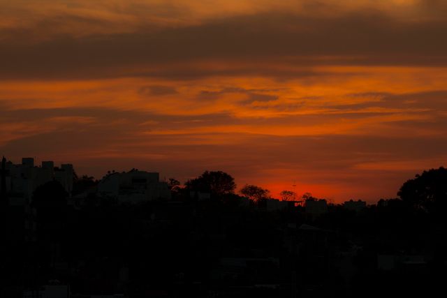 Serene Sunset Over Silhouetted Urban Landscape - Download Free Stock Photos Pikwizard.com
