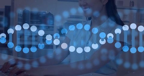 Smiling asian woman typing on laptop with digital dna helix overlay for biotech research