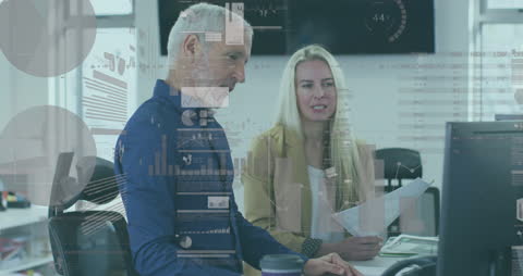 Business Professionals Analyzing Financial Data on Screens