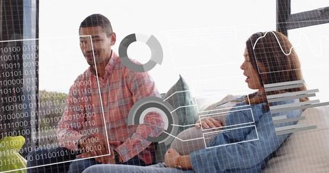 Midadult women discussing analytics on sofa with transparent dataviz overlay and charts