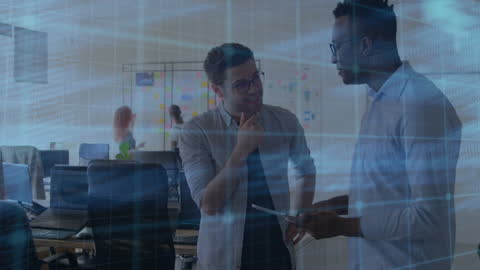 Diverse Colleagues Discussing Tech in Modern Office