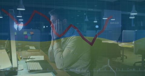 Stressed businessman analyzing financial data trends in office
