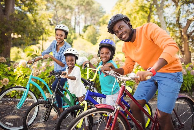 Happy African American Family Riding Bicycles in Park - Download Free Stock Photos Pikwizard.com