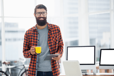 Young Professional with Tablet and Coffee in Bright Office - Download Free Stock Videos Pikwizard.com