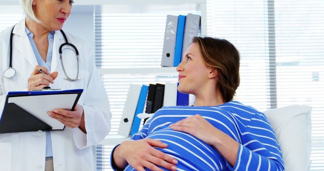 Pregnant Woman in Consultation with Female Doctor - Download Free Stock Images Pikwizard.com