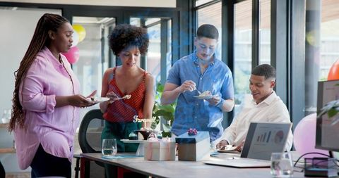 Colleagues celebrating farewell in modern office cutting cake with balloons and gifts