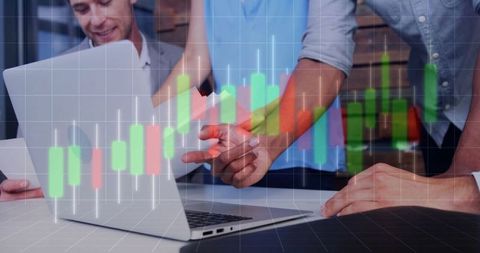Business Team Analyzing Financial Charts on Laptop
