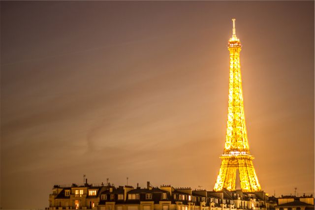 Eiffel Tower Illuminated at Night with City Skyline - Download Free Stock Photos Pikwizard.com