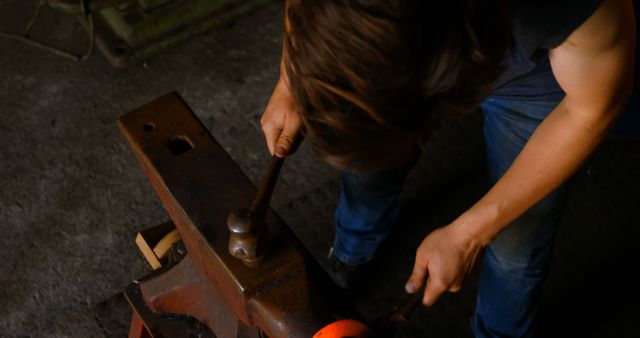 Blacksmith Working on Metal with Hammer in Workshop - Download Free Stock Images Pikwizard.com