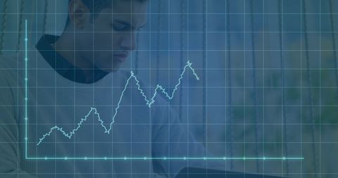 Businessman analyzing financial data with interactive graph