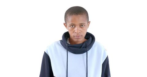 Individual in Casual Hoodie with Intense Gaze Showcasing Attitude