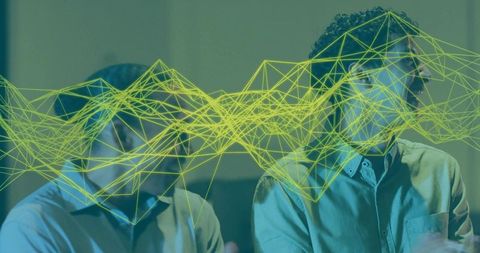 Neon wireframe overlay on professionals during tech presentation in teal boardroom