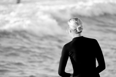 Surfer Preparing for Waves in Black and White