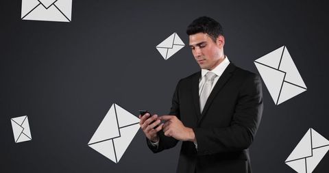 Businessman Connecting Through Smartphone with Floating Email Icons