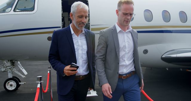 Businessmen Leaving Private Jet With Red Carpet - Download Free Stock Images Pikwizard.com