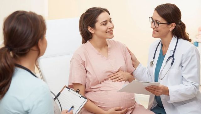 Pregnant woman in clinic with medical professionals